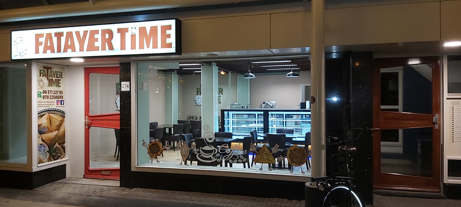 Fatayer Time storefront at night